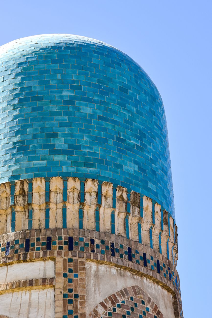 Shot of a blue-tiled minaret from the Chor Minor Madrasa in Bukhara, Uzbekistan