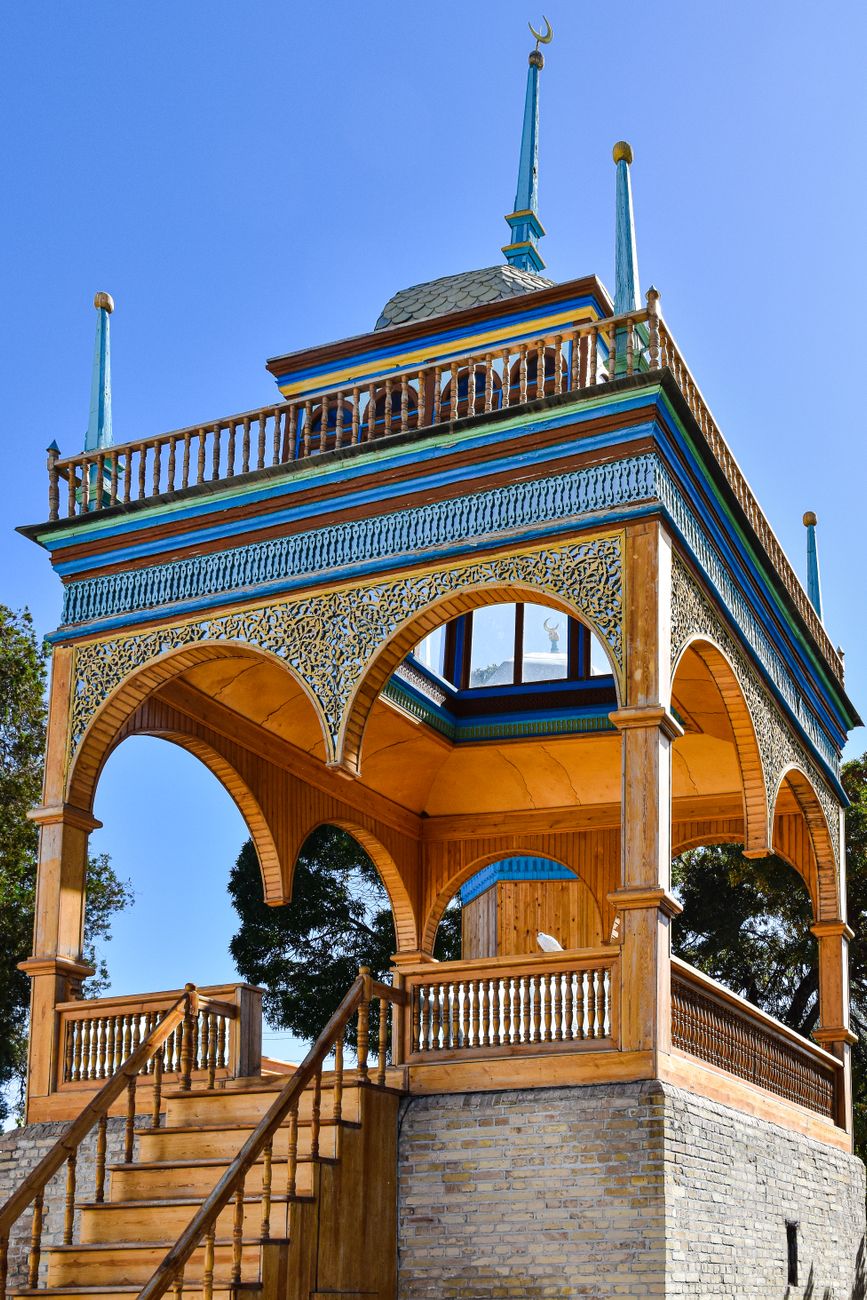 Elegant wooden pavilion in Uzbekistan showcasing intricate architecture and cultural heritage · Bukhara, Uzbekistan