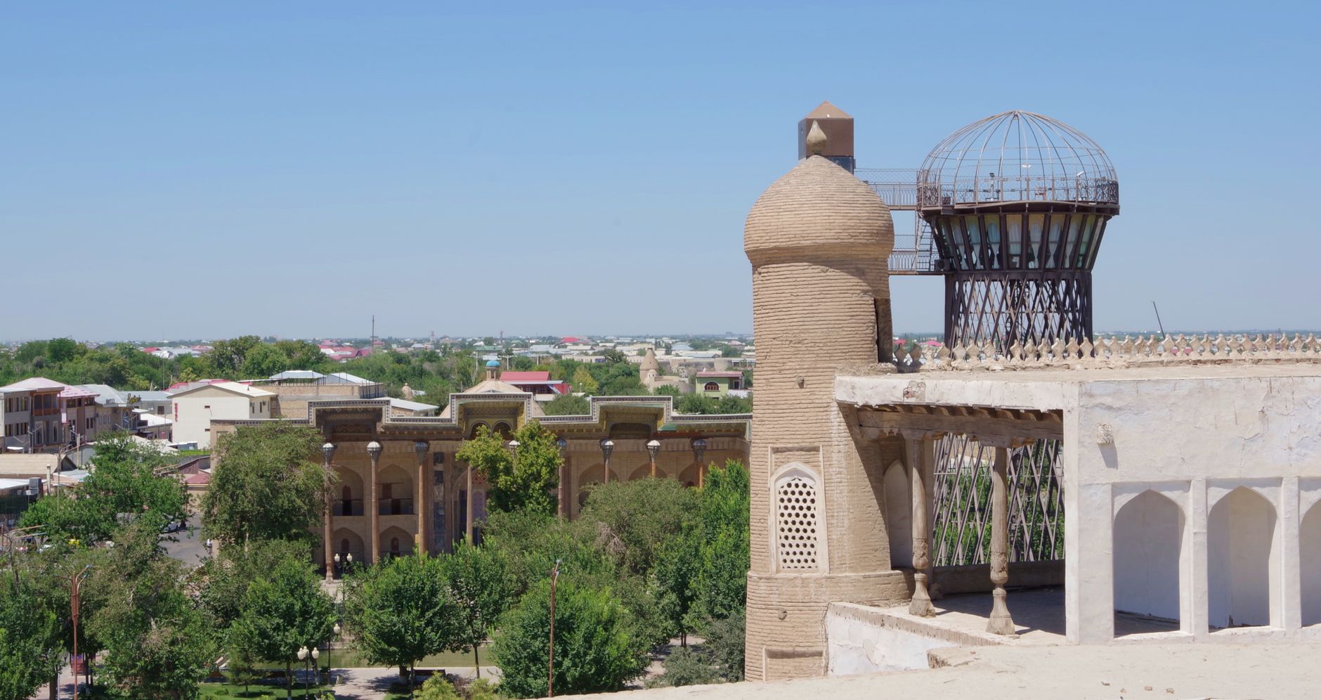 Scenic view of ancient buildings and lush greenery in Boukhara, Uzbekistan · Bukhara, Uzbekistan