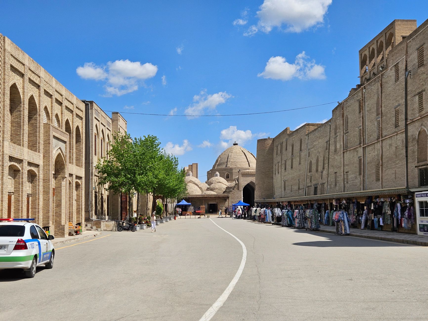 The historic market street in Bukhara, Uzbekistan, under a clear blue sky · Karakalpakstan, Uzbekistan
