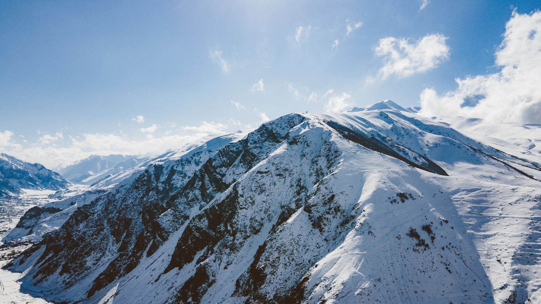 Winter view of snow-covered mountains under a clear blue sky · Fann Mountains, Tajikistan, Uzbekistan