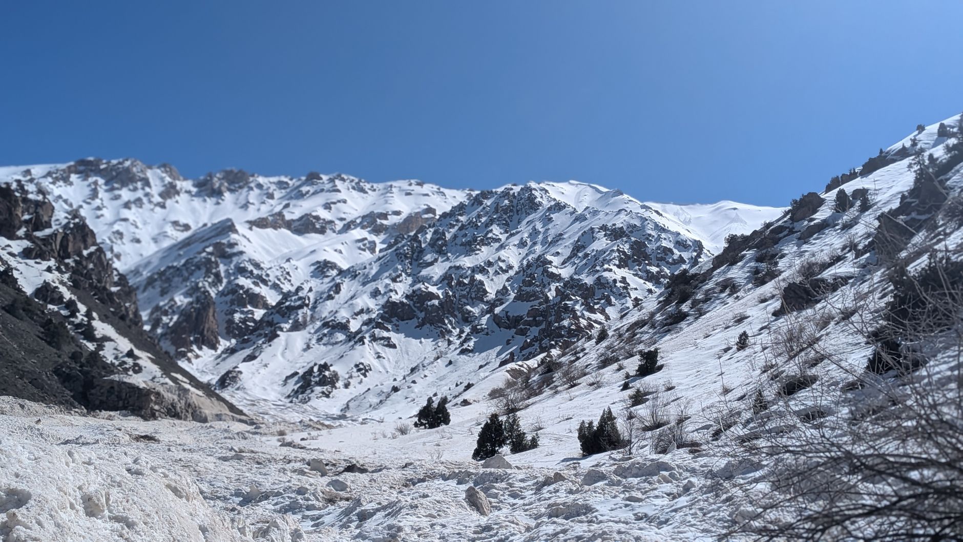 Snow-covered mountains under a clear blue sky, captured in Tashkent, Uzbekistan · Fann Mountains, Tajikistan, Uzbekistan