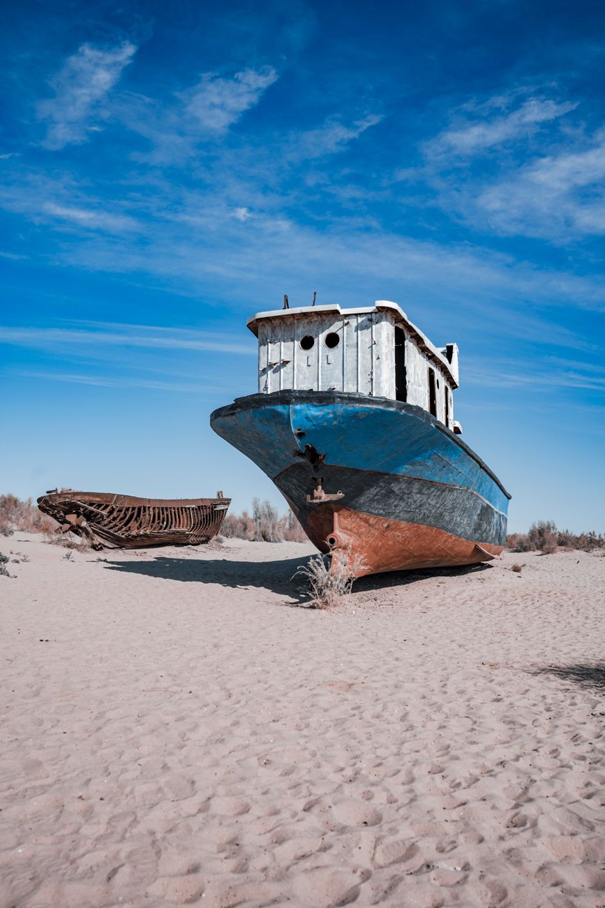 Rusting ships stranded in the Aral desert, showcasing ecological disaster in Uzbekistan · Muynak & the Aral Sea, Uzbekistan