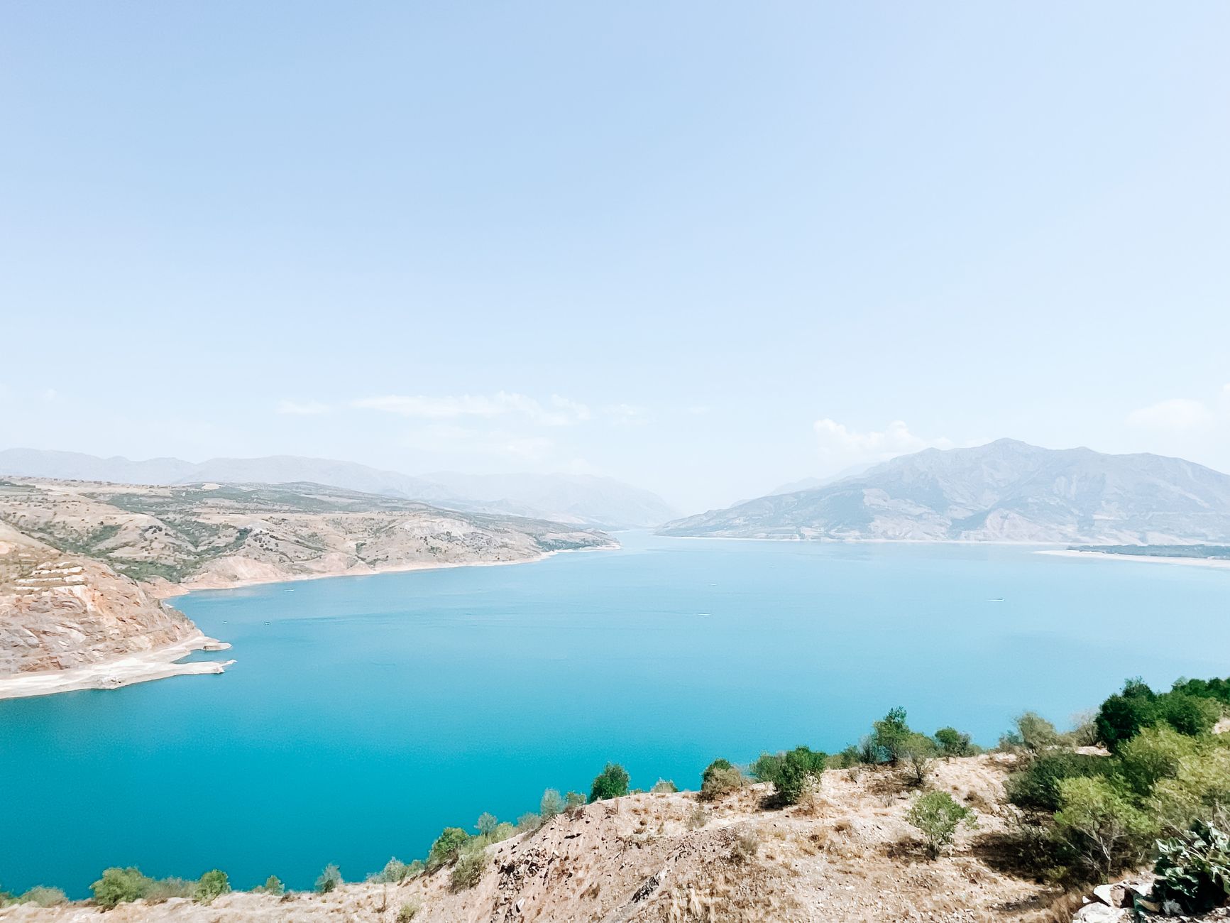 Aerial view of Charvak Reservoir and surrounding mountains in Tashkent Region, Uzbekistan · Nurata & Aydarkul, Uzbekistan