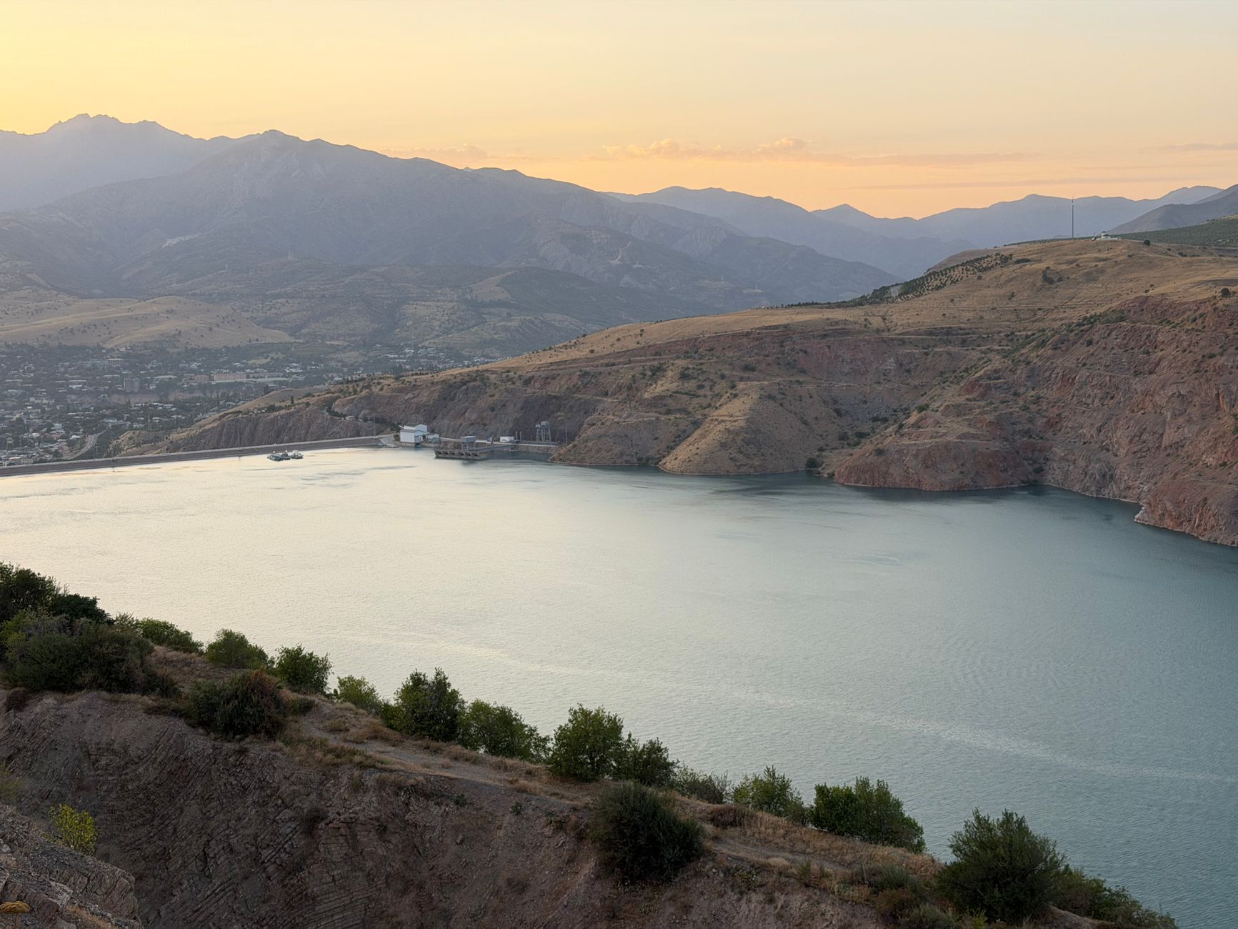 Charvak Reservoir at sunset, surrounded by mountains in Uzbekistan · Nurata & Aydarkul, Uzbekistan