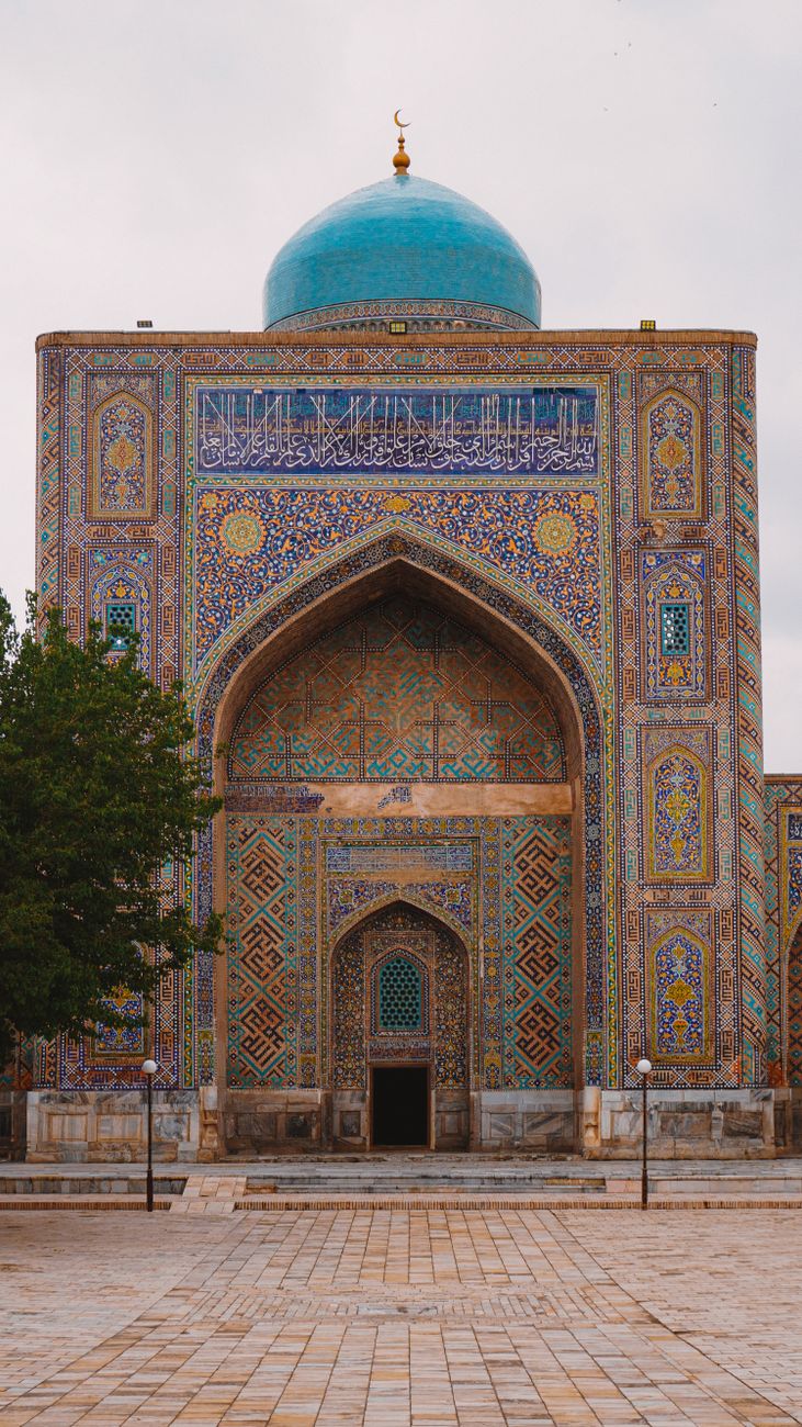 Intricate architectural facade of a mosque in Samarkand, showcasing rich patterns and a prominent turquoise dome · Quick facts, Uzbekistan