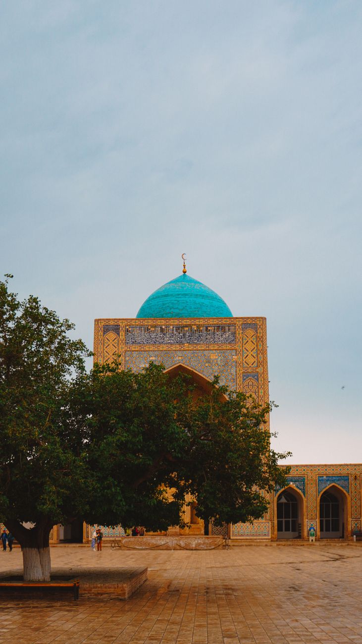 View of a historical madrasa with iconic blue dome in Bukhara, Uzbekistan · Shakhrisabz, Uzbekistan