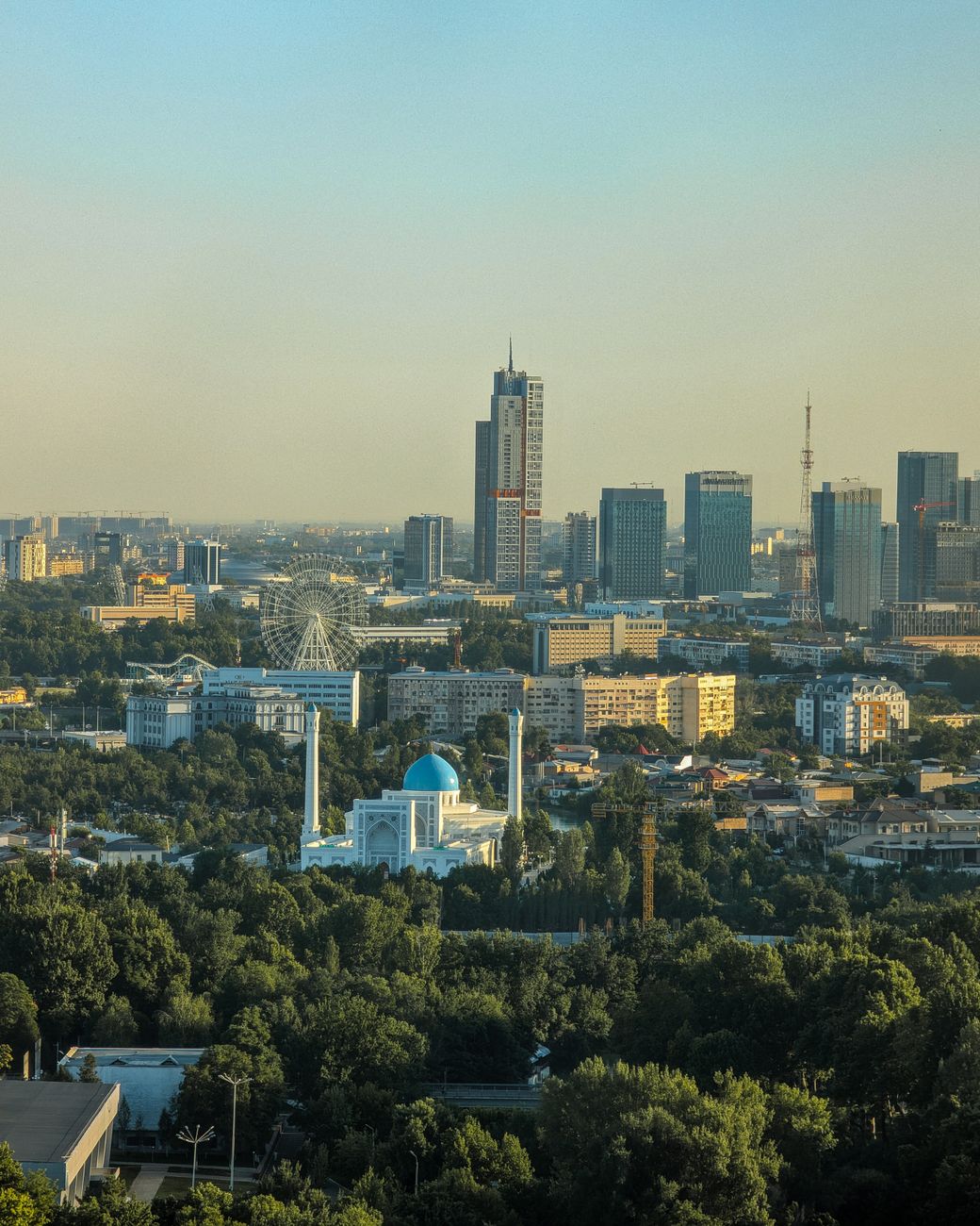 Daytime aerial view of Tashkent skyline featuring modern buildings and historic architecture, Uzbekistan
