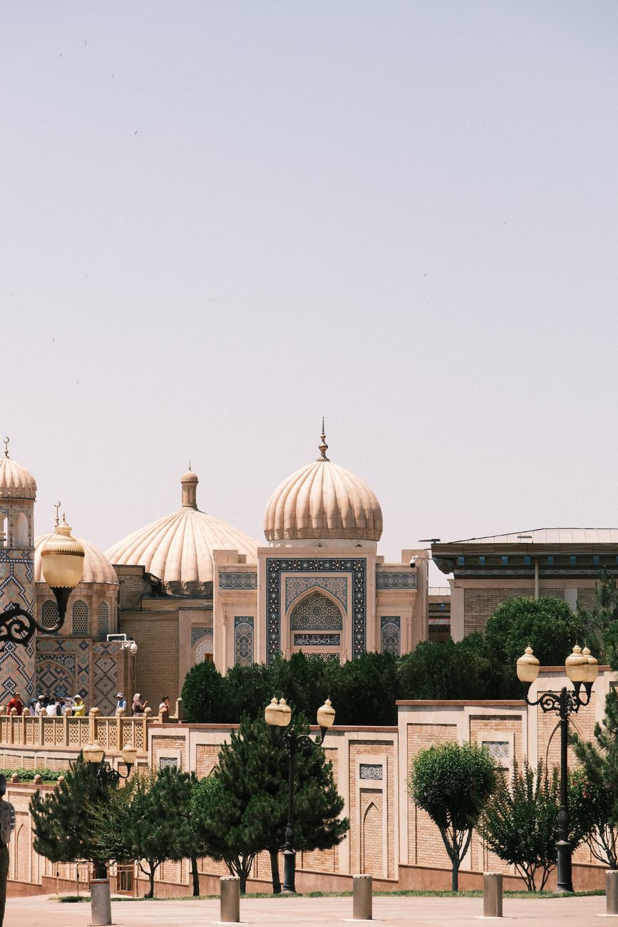 Beautiful mosque domes with intricate design under clear sky, Uzbekistan