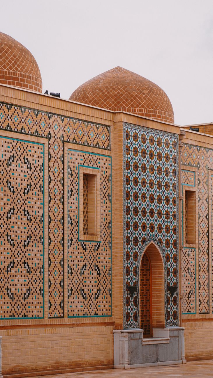 Detailed mosaic and tile work on a historical mausoleum in Samarkand, Uzbekistan
