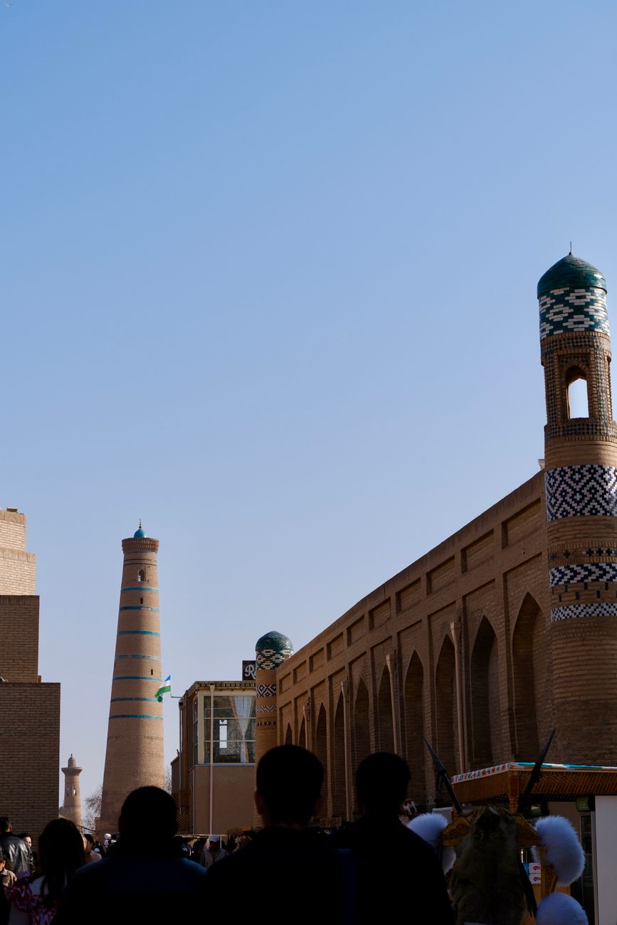 Historic minarets in Khiva, Uzbekistan, against a clear blue sky