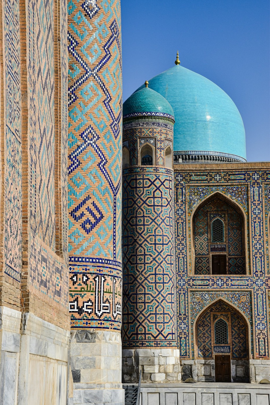 Tilya-Kori Madrasa minaret and twin turquoise domes at the Registan, Samarkand