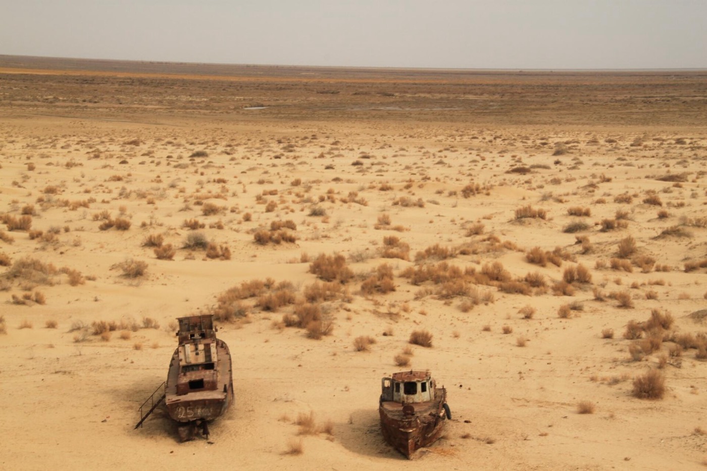 Rusting Soviet fishing vessels on the dry seabed at Muynak